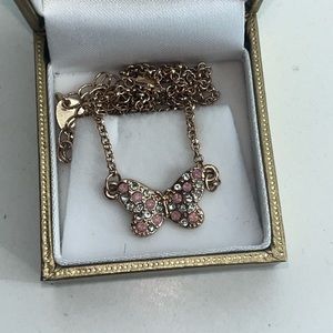 Pink and silver rhinestone butterfly on gold chain